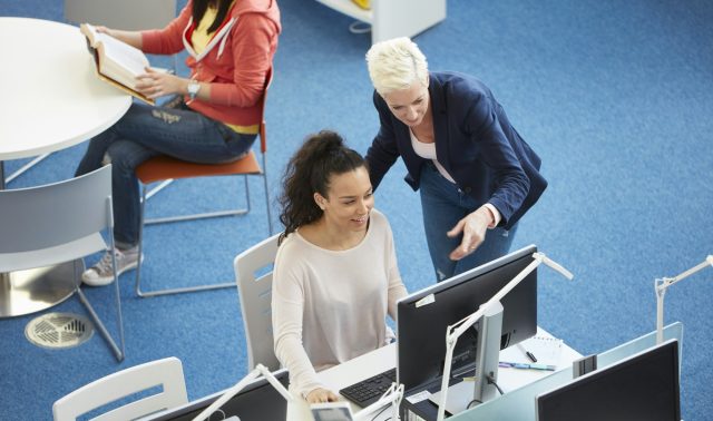 University students working in library